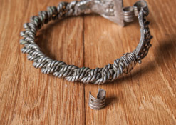 Серебряный браслет Великого Княжества Литовского, 14 - нач. 15 века. Витые из четырех провлочных жгутов с треугольными пластинами, покрытыми крупной зернью.