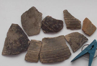 Черепки горшка в котором был клад серебряного пояса