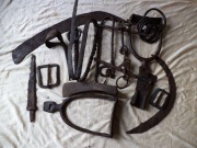 Стремена и удила в наборе с топором, парой серпов, ножом, пряжкой и еще какими-то предметами из крученого железного прута